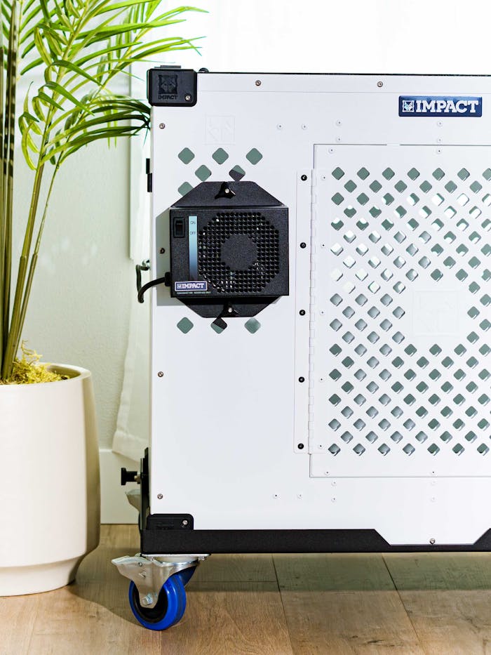 High-quality dog crate with modern design and ventilation unit in a cozy living space.